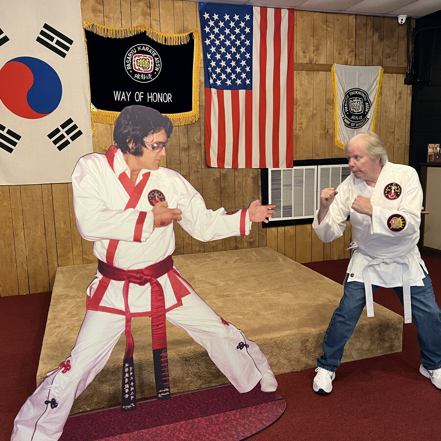 Billy Stanley, Elvis stepbrother, posing with Elvis standee at TigerMan Museum